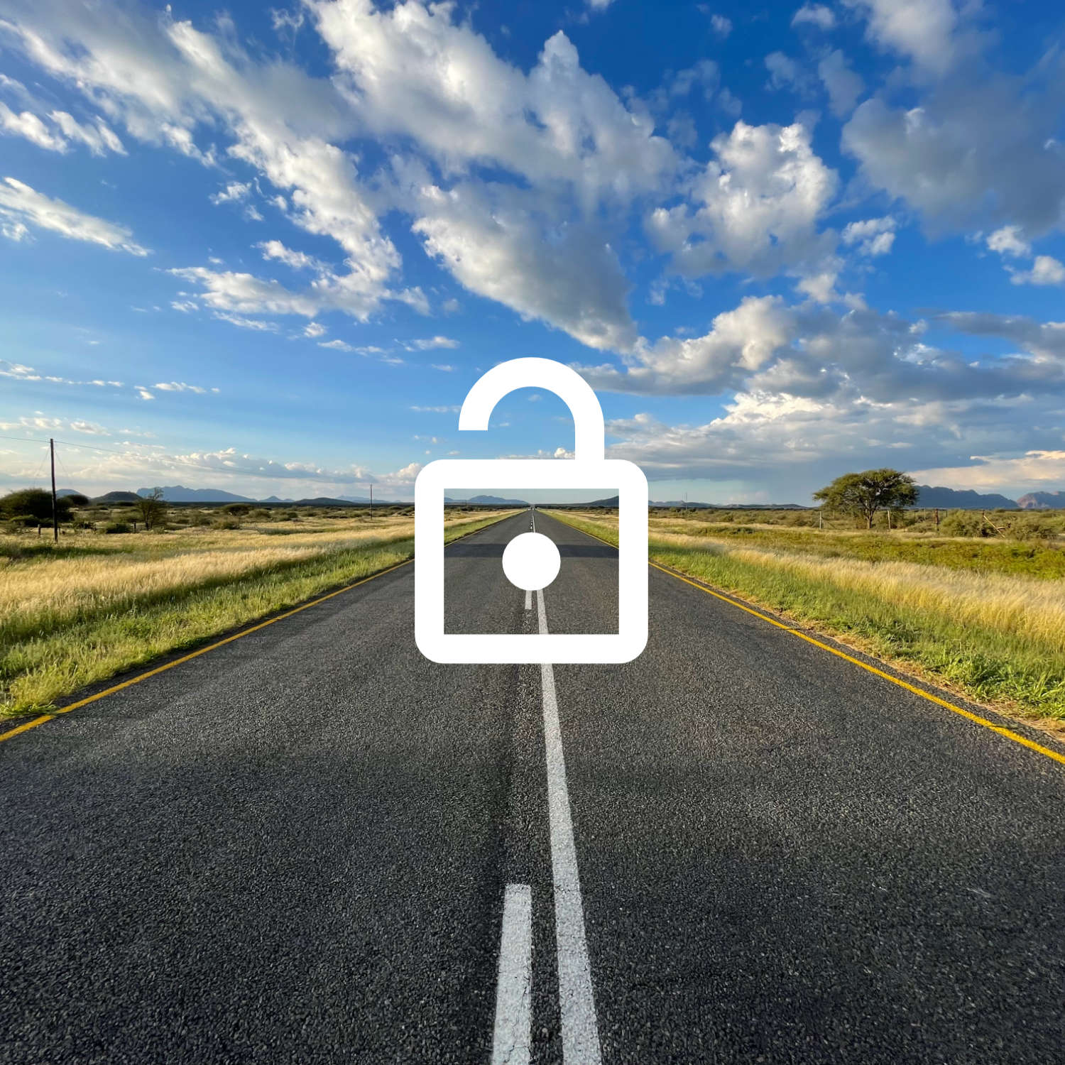 A tarmac road in Namibia, with an open lock in front of it